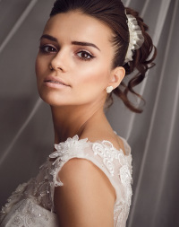 Beauty portrait of young bride. Perfect makeup and hairstyle.